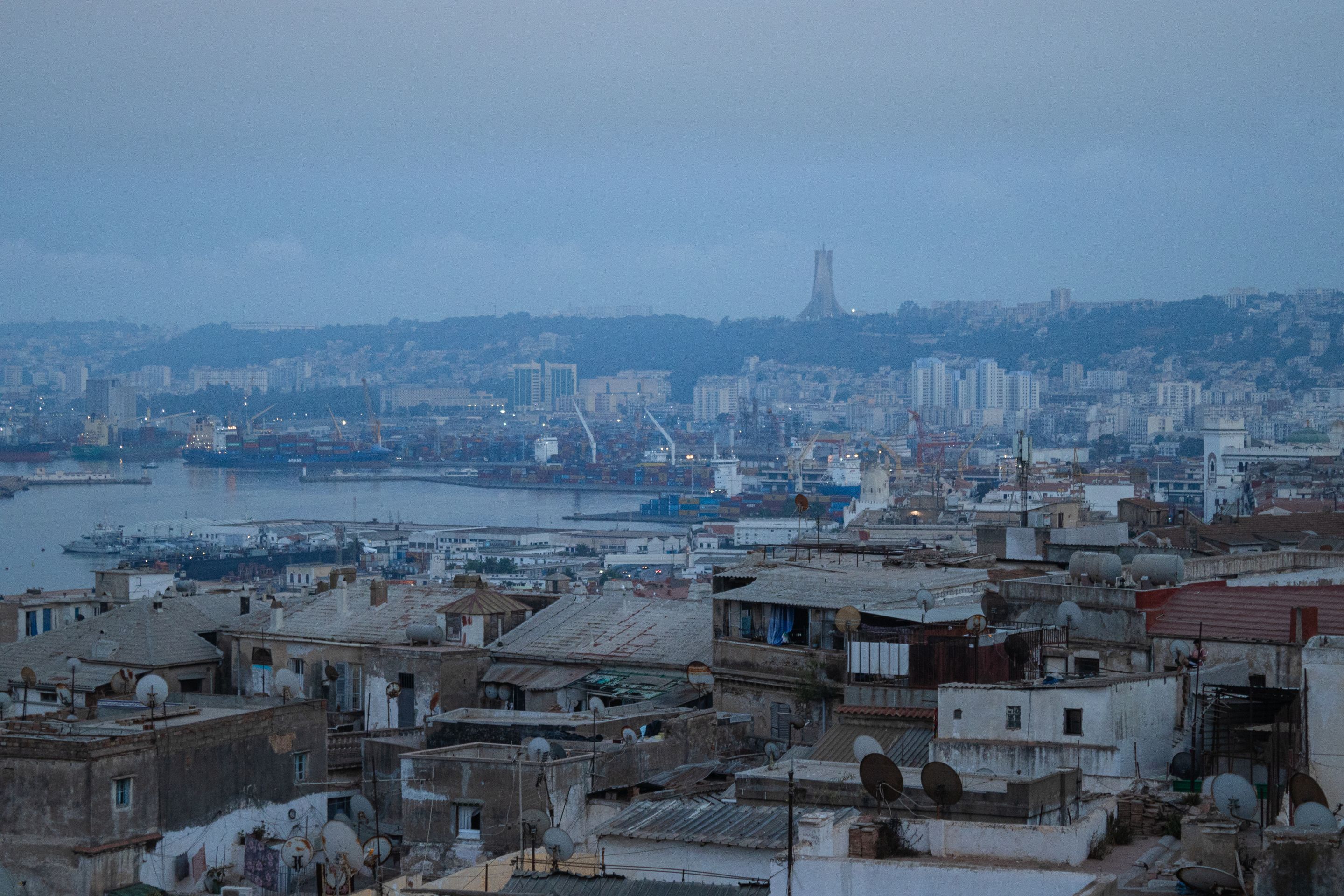 Aerial view of Algiers cityscape showcasing iconic architecture and Martyrs' Memorial.