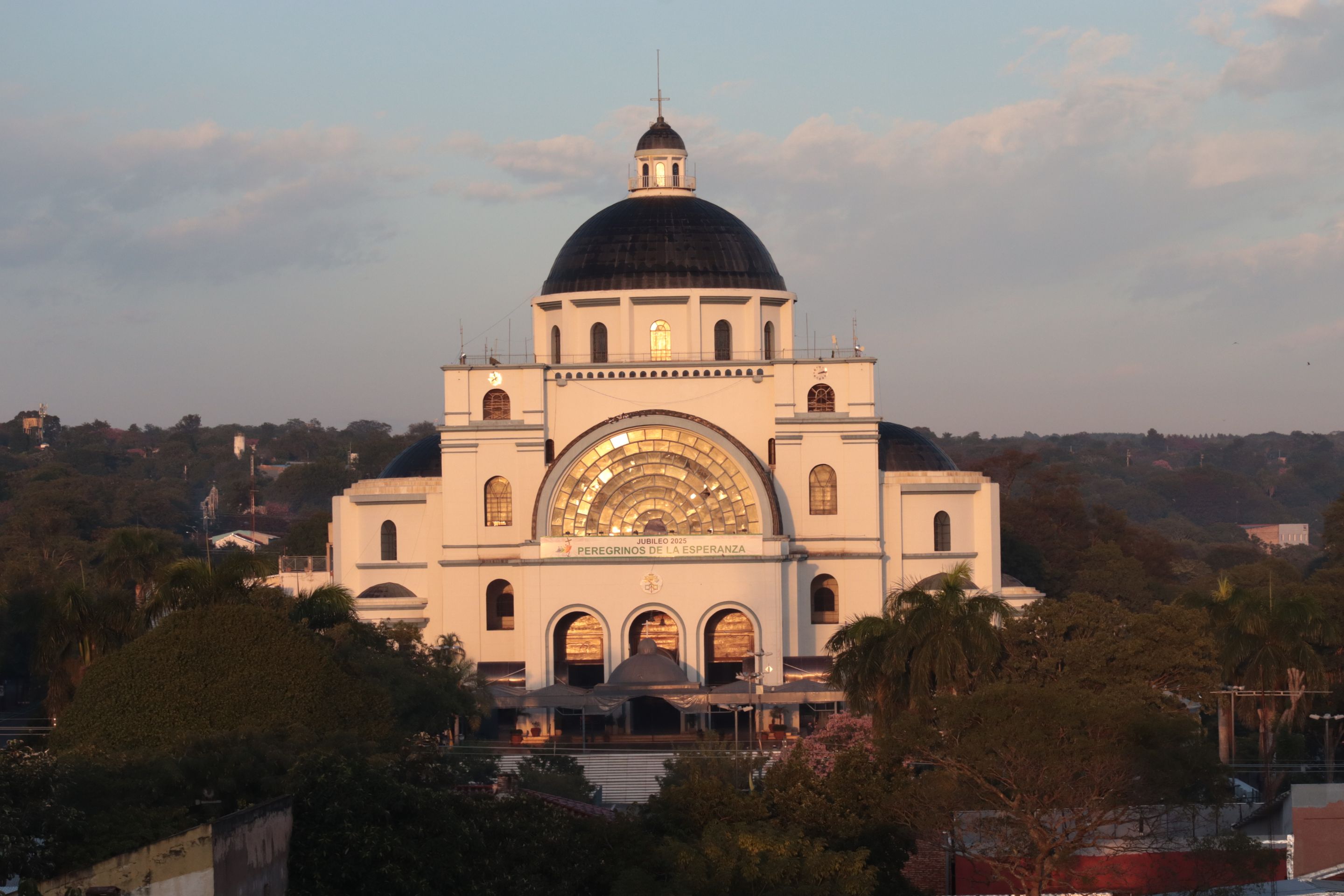 Stunning view of the Basilica of Our Lady in Caacupé during a golden sunset.