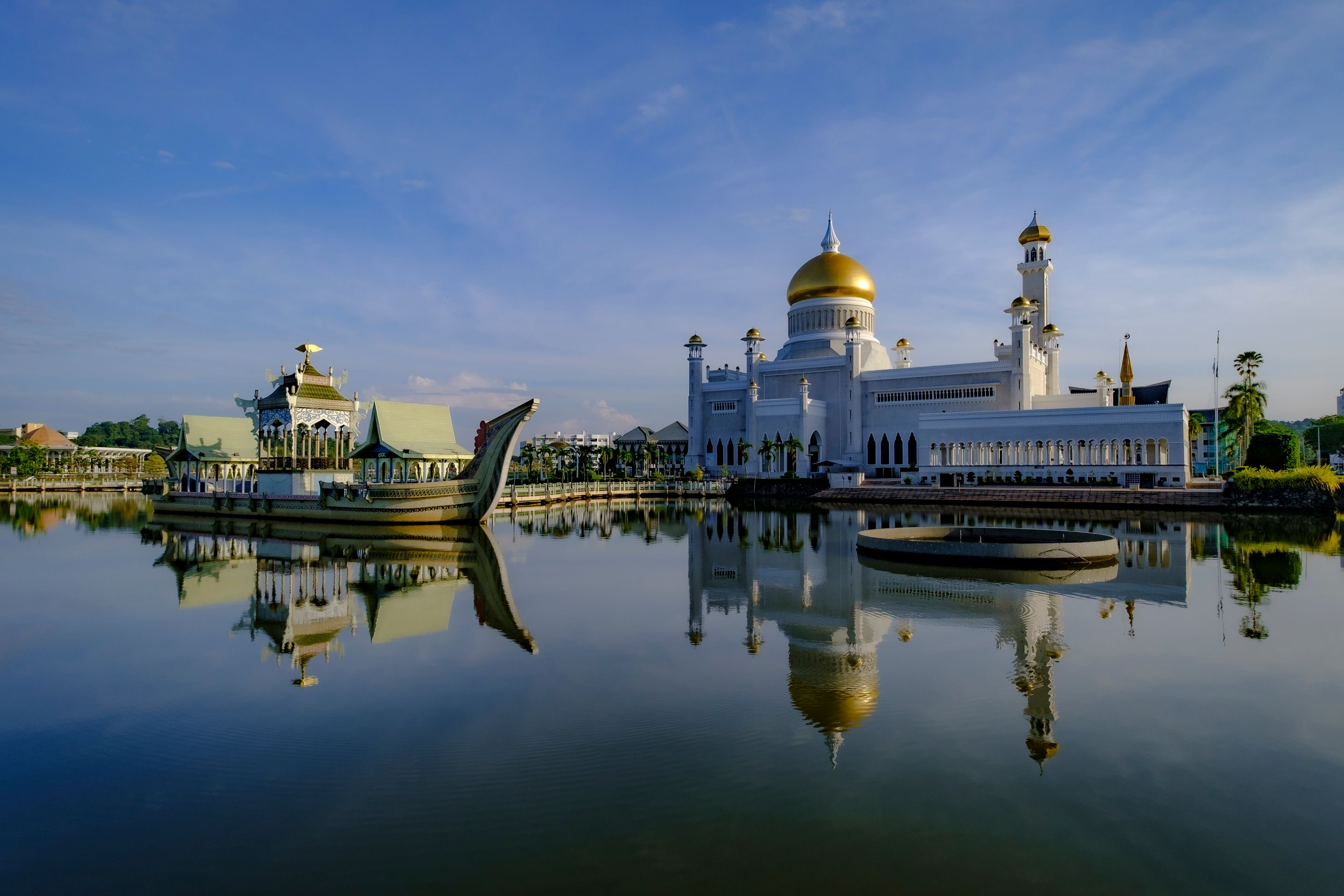 Stunning view of Omar Ali Saifuddien Mosque with its reflection in Brunei, captured at sunrise.