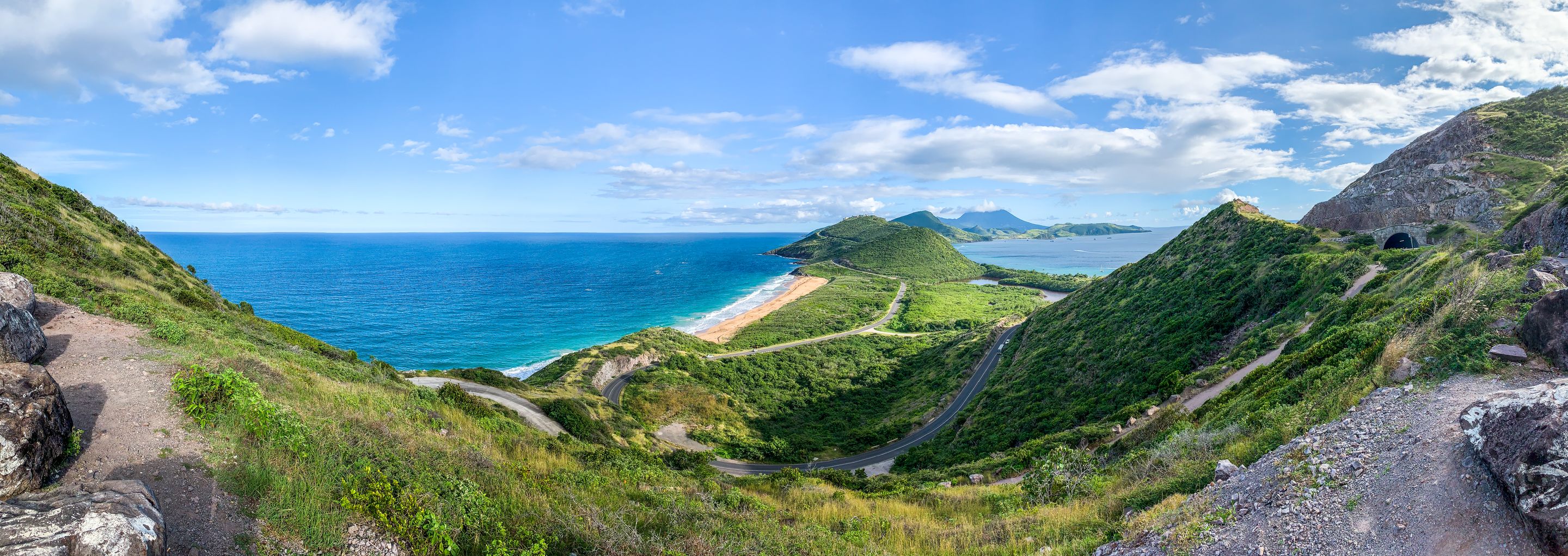 Breathtaking panoramic view of Saint Kitts lush coastline and vibrant ocean.