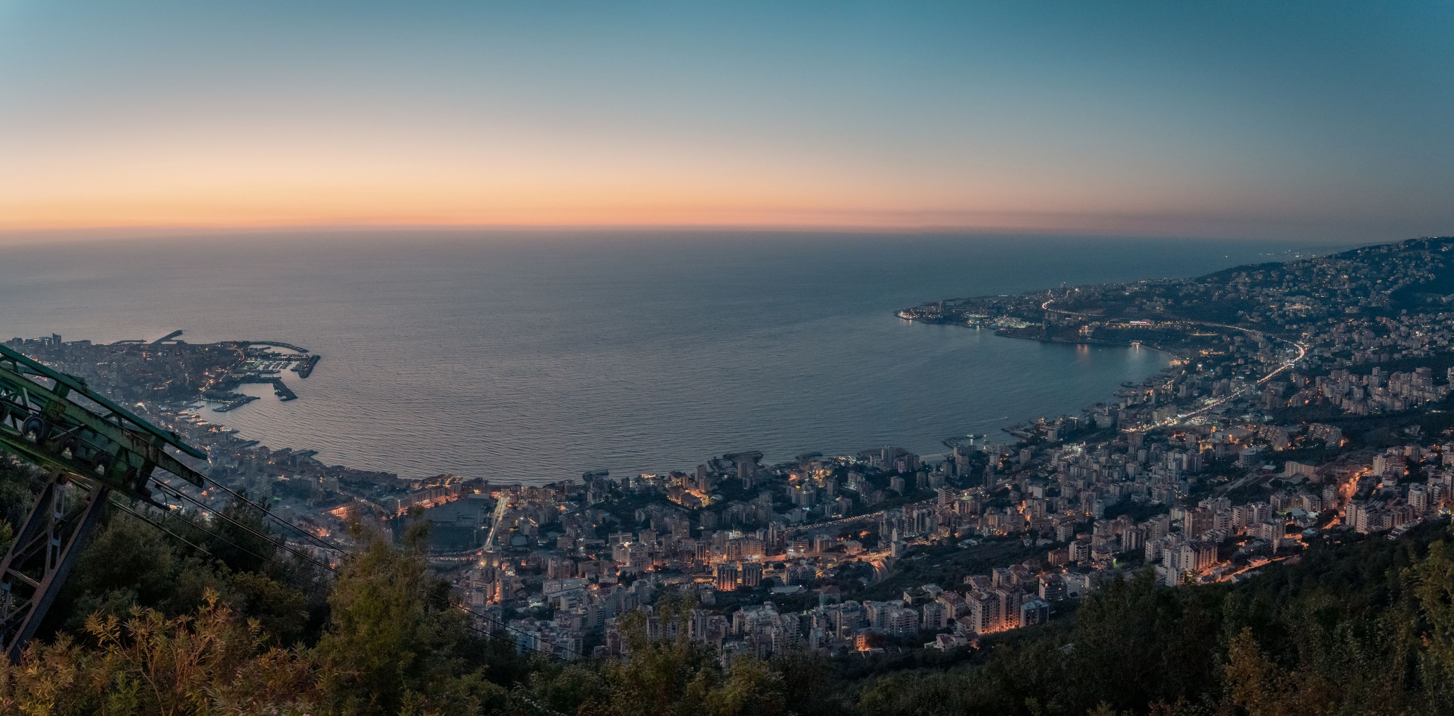 Aerial view of Harissa over Beirut, Lebanon, with cityscape and coast at sunset