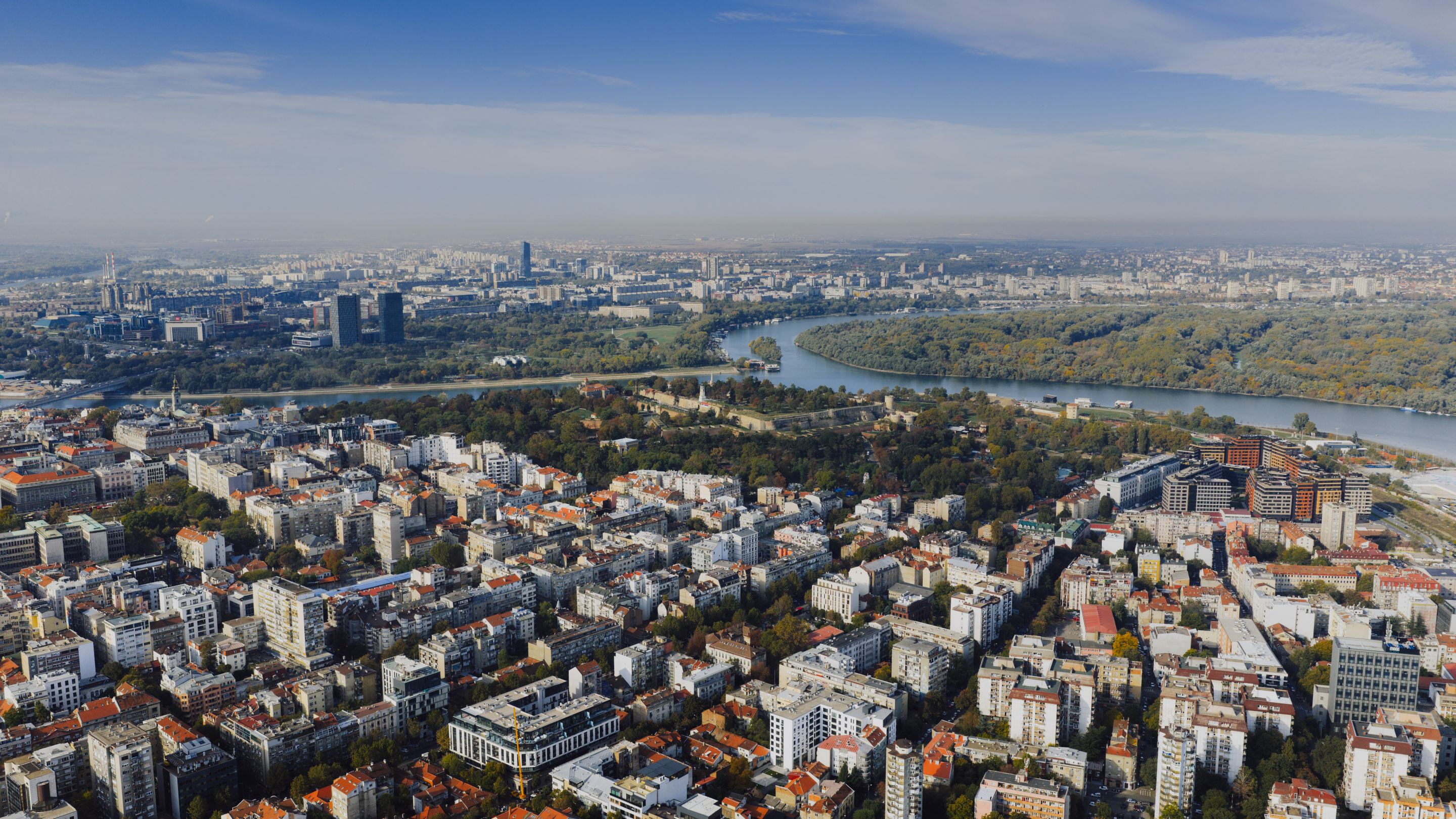 Stunning aerial view of Belgrade cityscape with the Danube river and city skyline in Serbia.