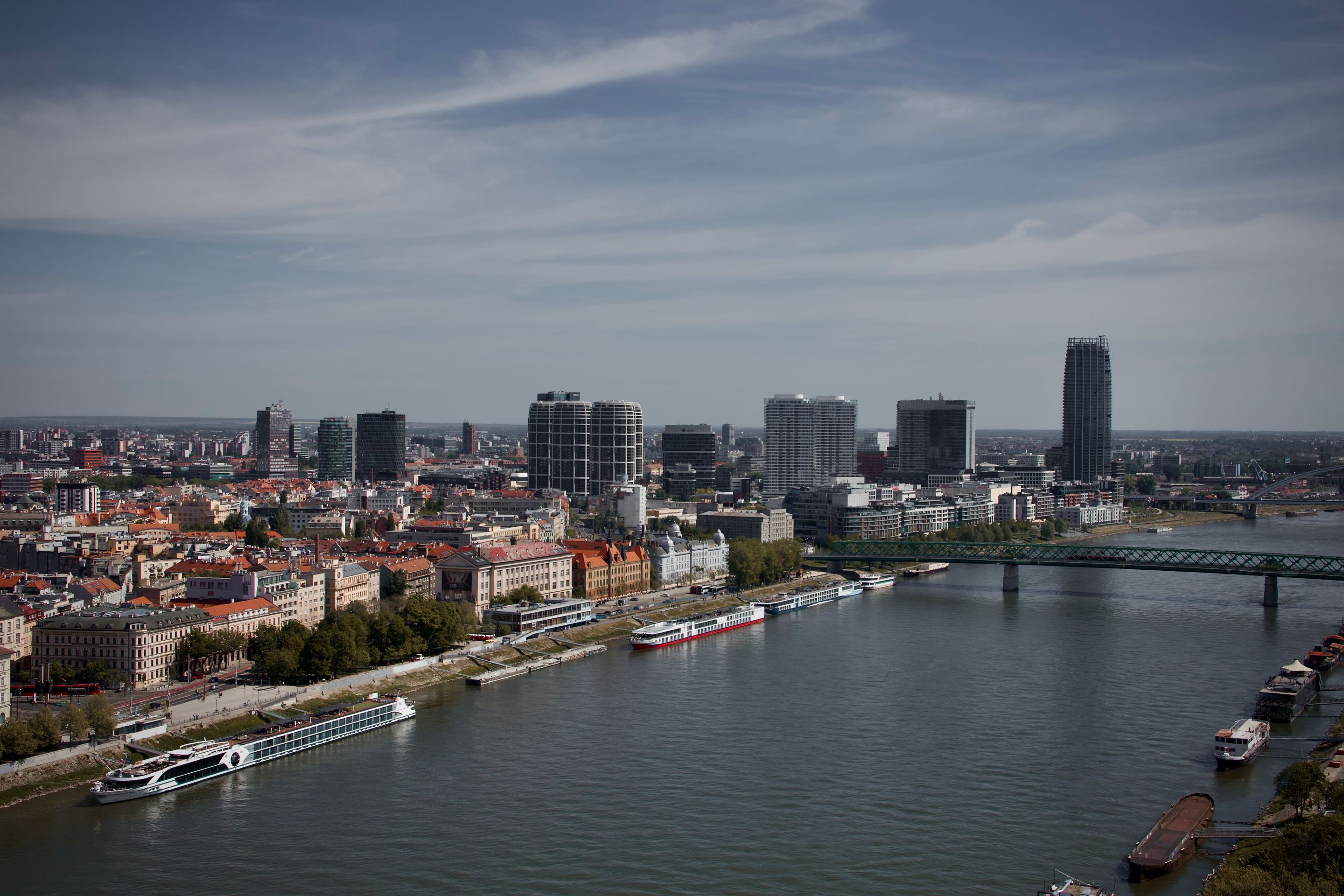 Stunning aerial view of Bratislava's skyline with modern architecture and the Danube River.
