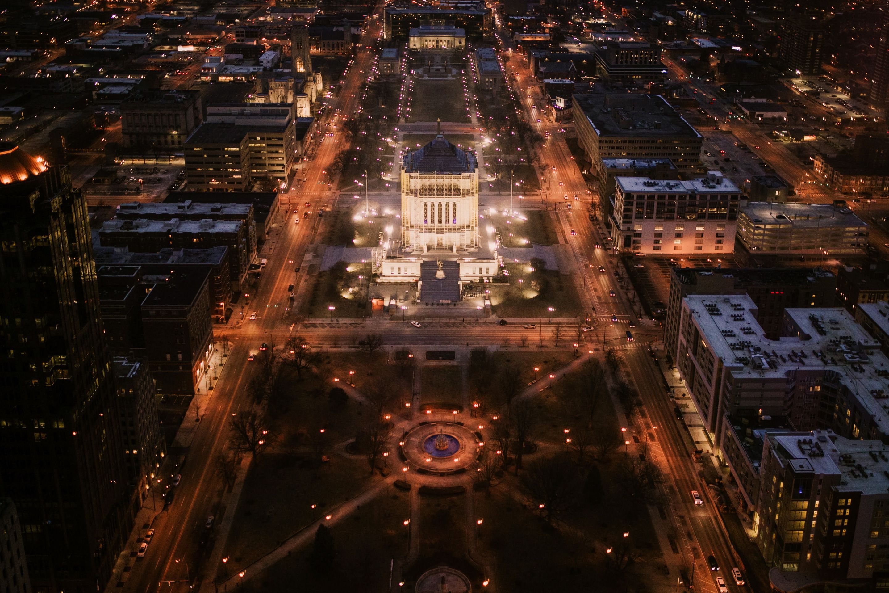 Breathtaking aerial night view of downtown Indianapolis featuring city lights and urban architecture.