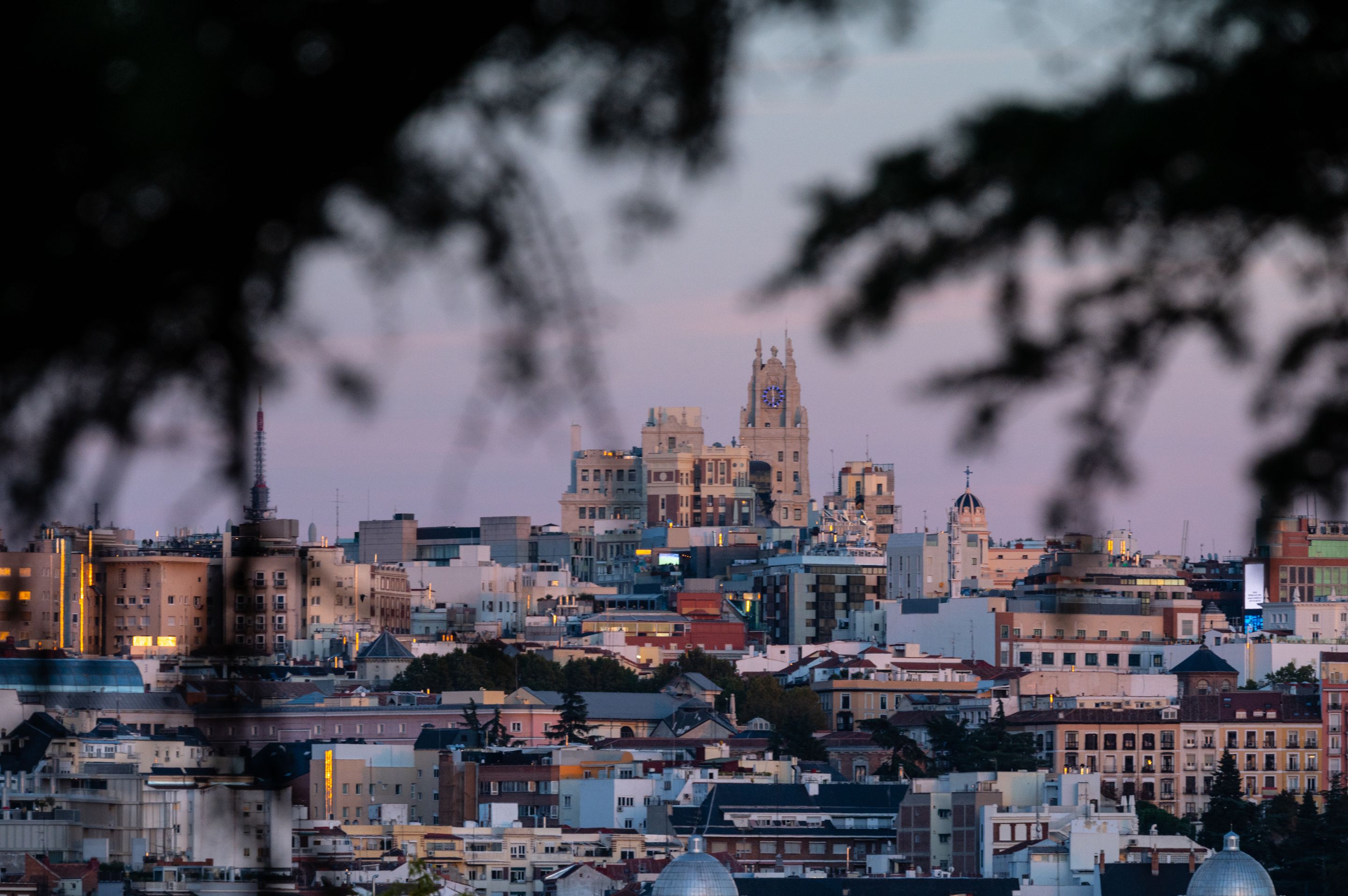 Beautiful cityscape of Madrid, Spain, captured during twilight with iconic landmarks visible.