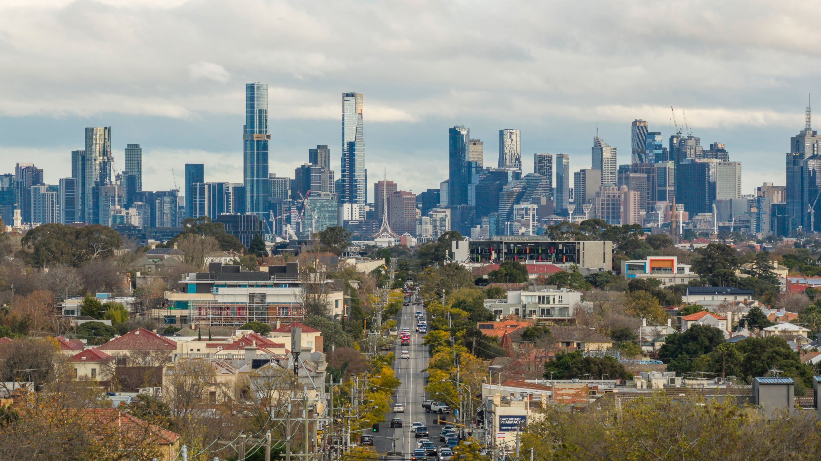 A view of Melbourne's skyline as seen from Hawthorn, showcasing prominent skyscrapers and urban landscape.