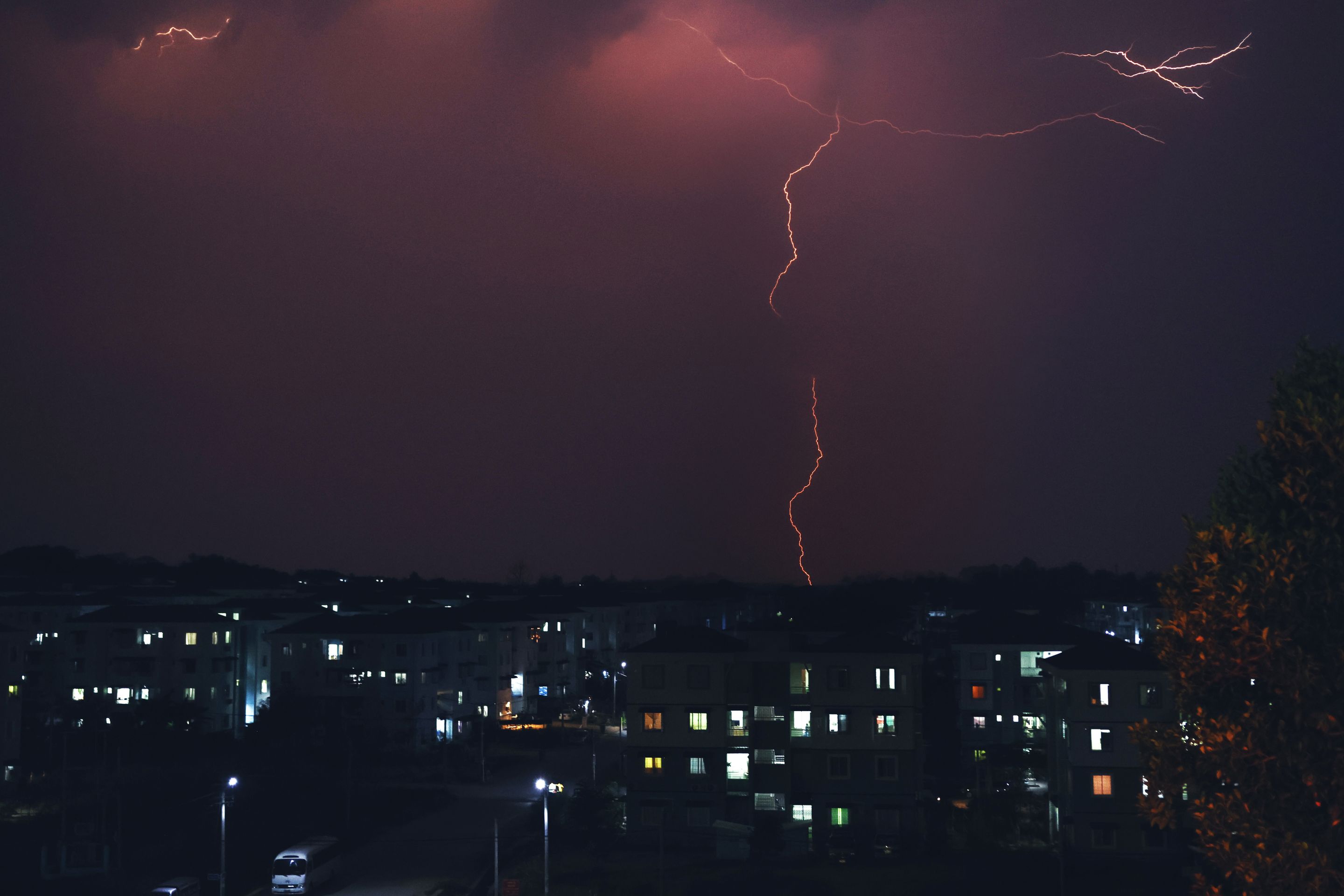 Lightning illuminates the night sky over an urban landscape in Naypyidaw, Myanmar.