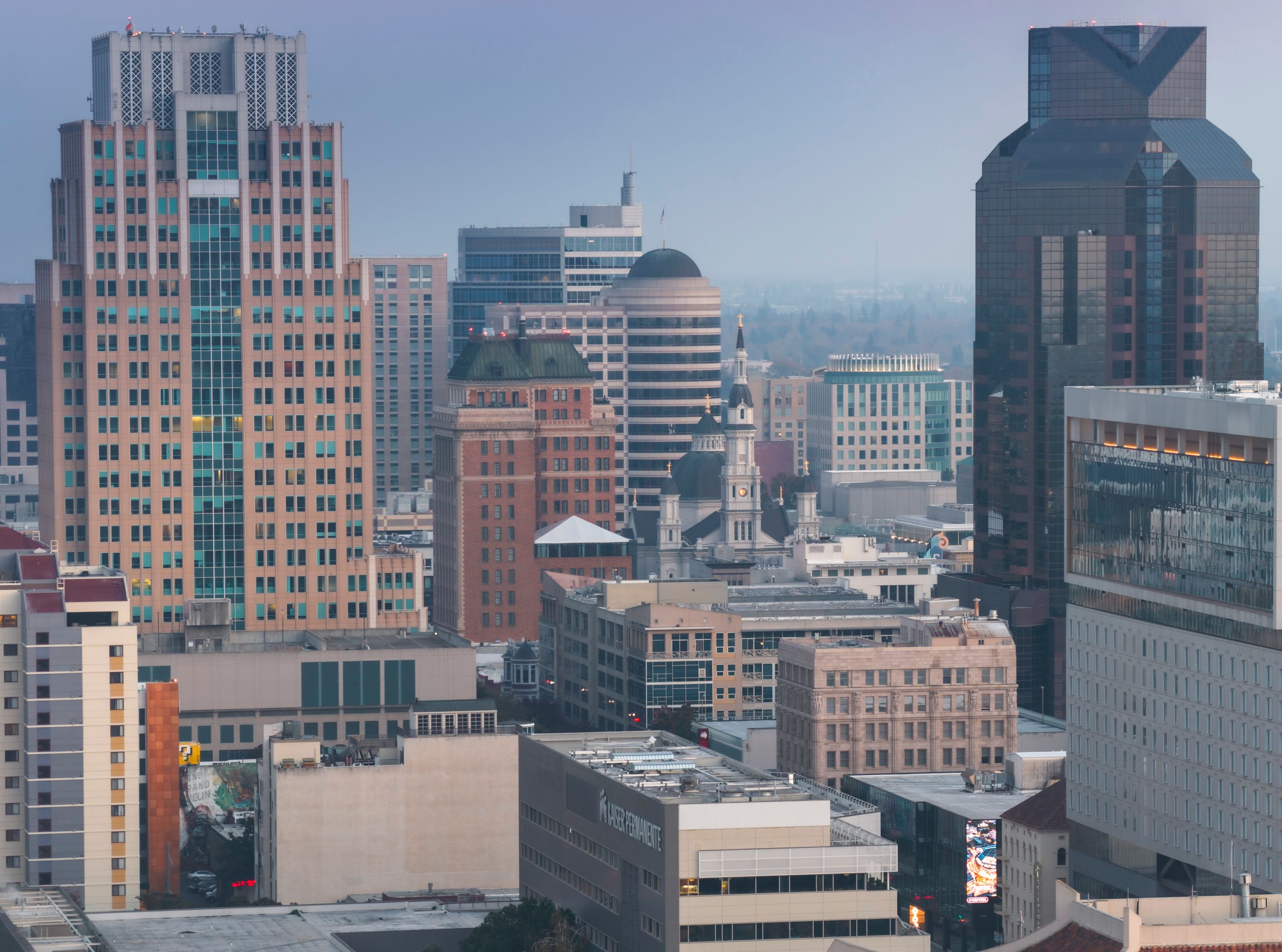 A captivating view of Sacramento city skyline with diverse architecture during twilight.