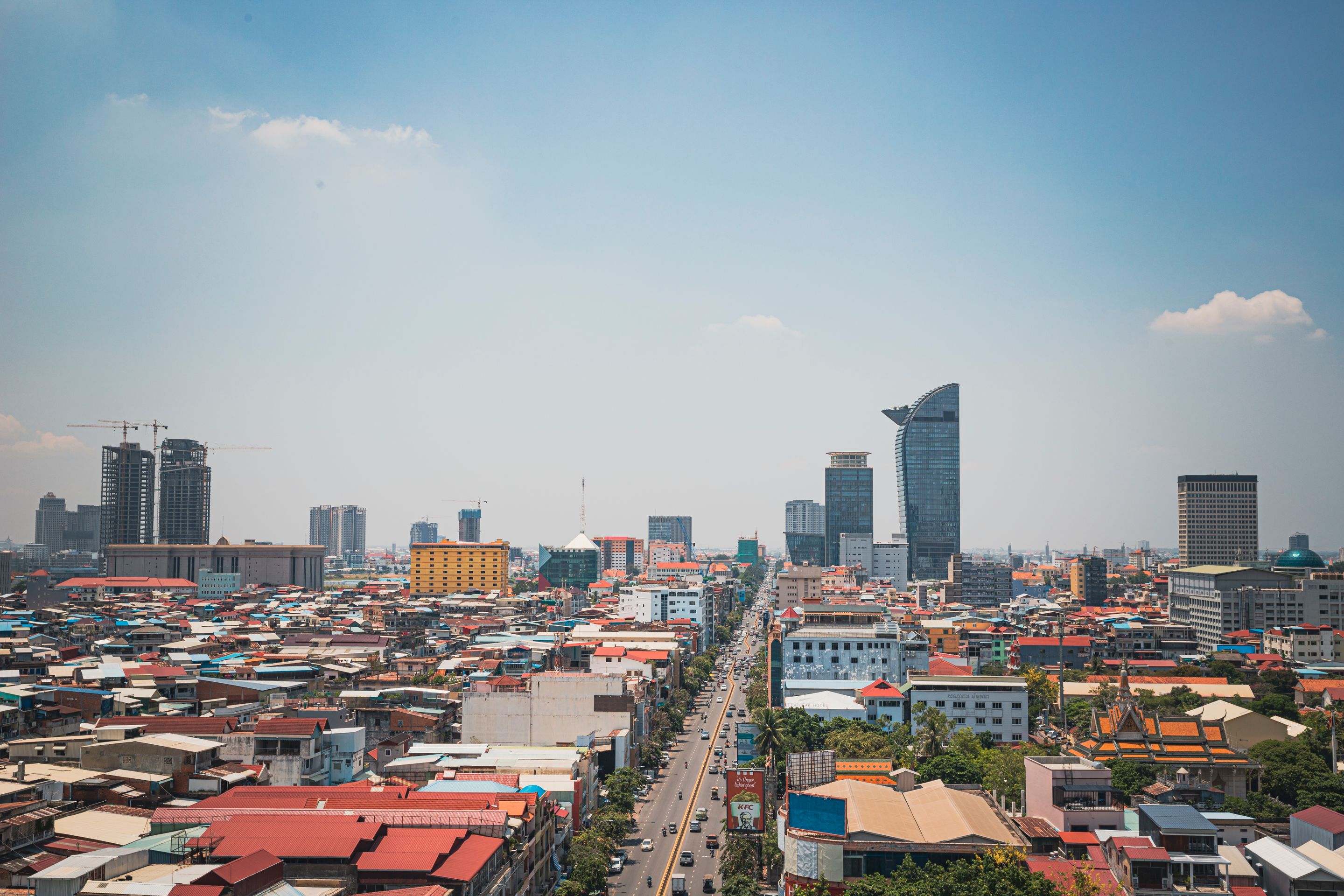 Discover the modern skyline and bustling streets of Phnom Penh from an aerial perspective.