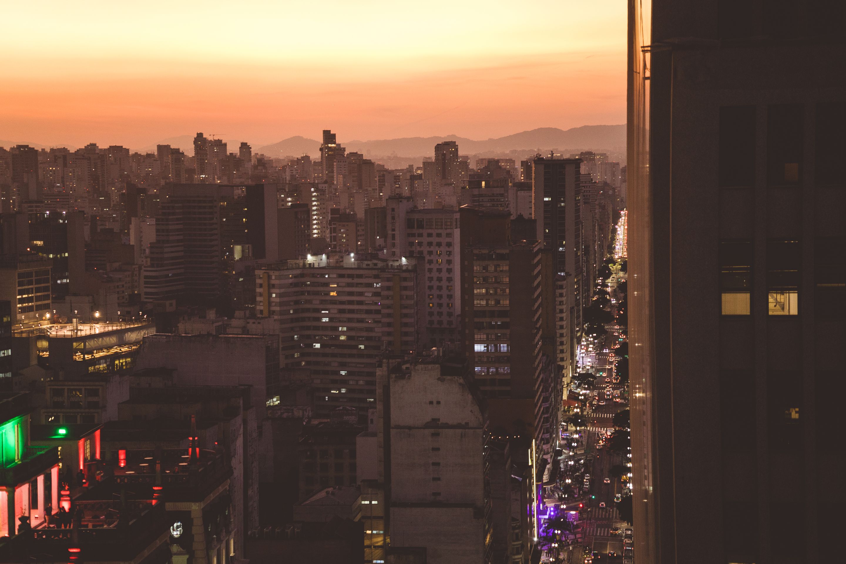 A breathtaking view of Sao Paulo's skyline illuminated during sunset, showcasing urban architecture.